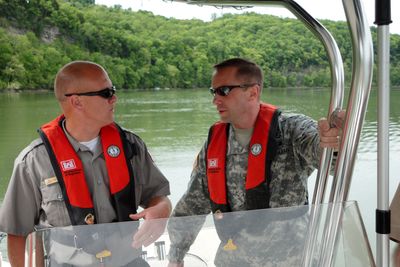 A U.S. Army Corps of Engineers commander aboard a boat on Cordell Hull Lake.