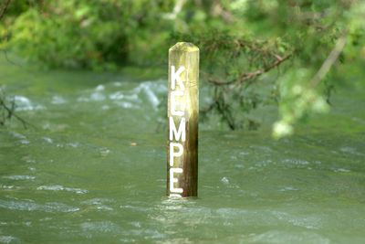 Campsite marker standing in high water on Dale Hollow Lake.